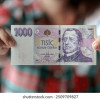 58124-01-online-a-spolehliva-pujcka-woman-holds-1000-czech-crown-260nw-2509709827.jpg