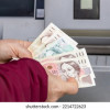 58319-01-rychla-financni-pujcka-woman-counts-money-withdrawn-atm-260nw-2214722623.jpg