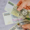 58602-01-rychla-financni-pomoc-czech-republic-banknotes-man-holding-czech-koruna-czk-bill-counting-czech-republic-banknotes-man-holding-czech-258480355.jpg